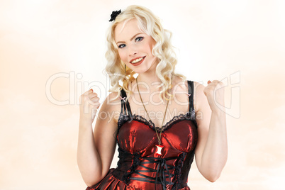 Woman with curly blond hair and happy cheers