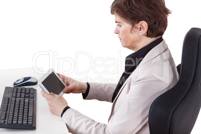 Businesswoman in office with tablet PC