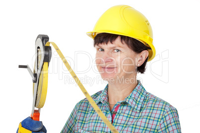 Construction worker with a tape measure