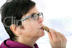 Woman eating cookie