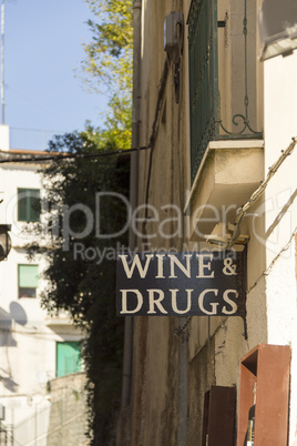 Wine and drugs sign on the wall