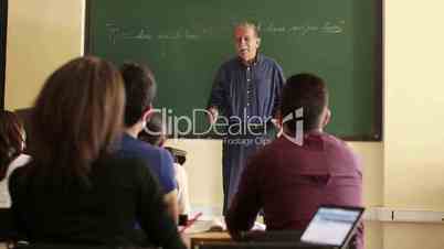 School people, professor talking to students during lesson in college