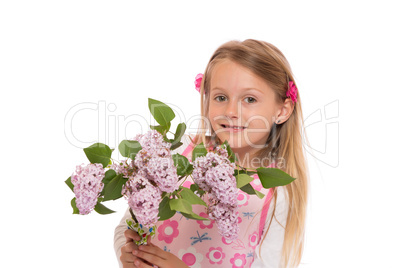 Happy little girl with lilac flowers