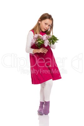 Pretty young girl with lilac flowers