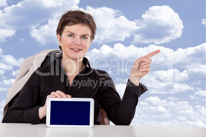 Woman holding tablet and raises a finger
