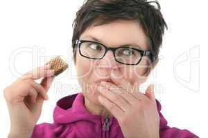 Woman eating biscuit