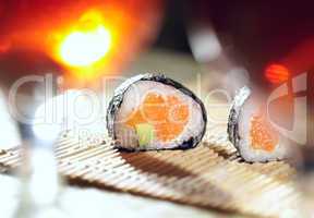 Sushi rolls and plum wine.