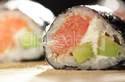 Susshi roll with salmon and avocado.