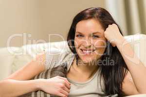 Young smiling woman relaxing at home