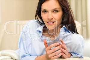 Portrait of woman with glass of water