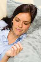 Peaceful portrait of woman sleeping on pillow