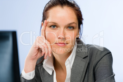 Calm confident businesswoman looking at camera