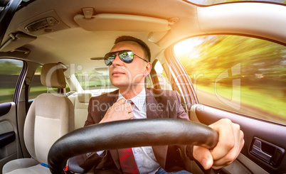 Man driving a car.