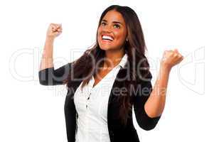 Excited businesswoman with clenched fists
