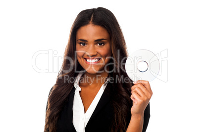 Attractive woman in formals holding CD