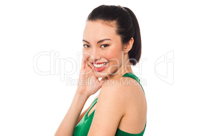 Shy young asian girl with a bright smile