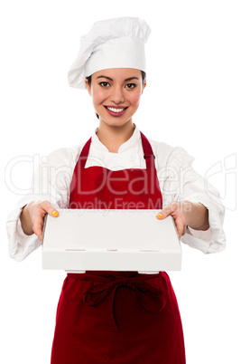 Attractive asian female chef delivering pizza