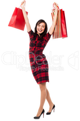 Excited shopping girl having great fun