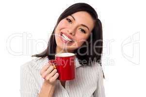 Woman enjoying coffee during work break