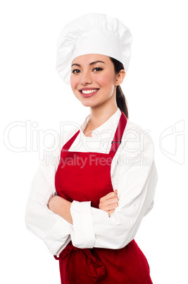 Cheerful confident young female chef