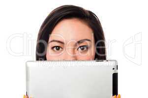 Asian model hiding her face with tablet device