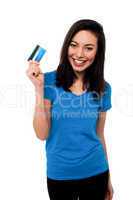 Smiling asian girl showing cash card