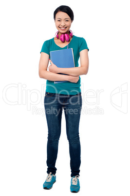 College girl with headphones around her neck