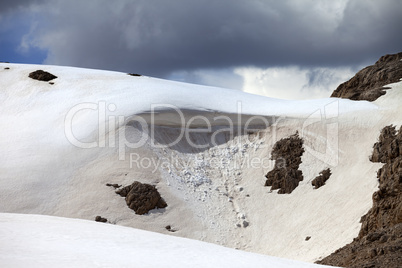 Snow cornice in mountains