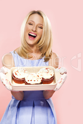 Attractive and beautiful woman with cupcakes