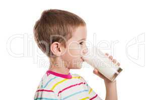 Smiling child boy drinking milk