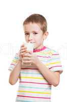 Smiling child boy drinking milk