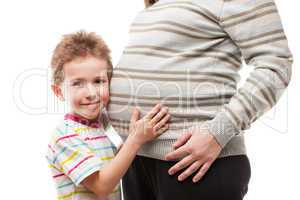 Little son touching or bonding his pregnant mother abdomen