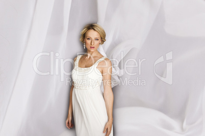 attractive blond woman in white dress
