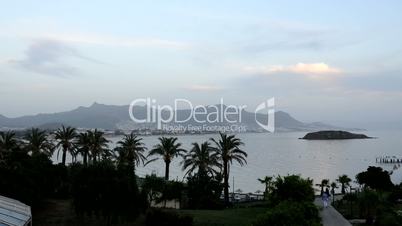 Timelaps of sunset and beach with a view on Bodrum resort in night illumination, Turkey