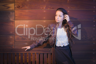 Mixed Race Young Adult Woman Portrait Against Wooden Wall