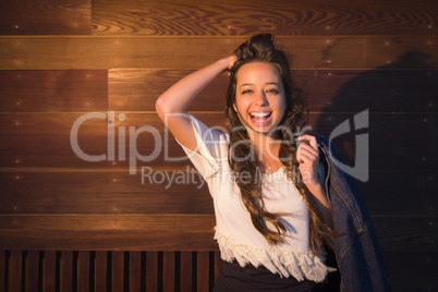 Mixed Race Young Adult Woman Portrait Against Wooden Wall