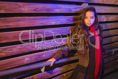 Mixed Race Young Adult Woman Against a Wood Wall Background