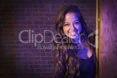 Pretty Mixed Race Young Adult Woman Against a Brick Wall