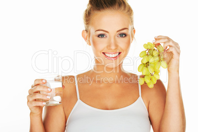 beautiful woman with water and grapes