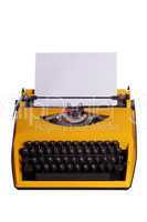 yellow typewriter with white paper