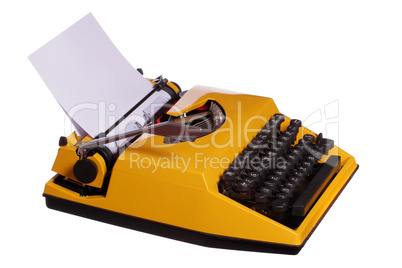 old yellow typewriter with paper