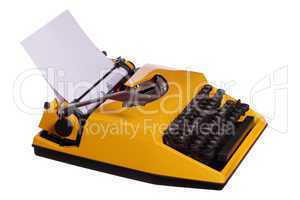 old yellow typewriter with paper