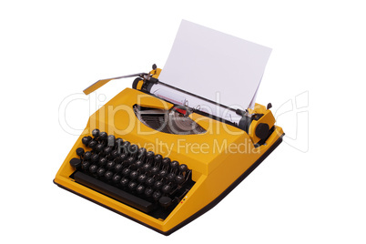 yellow typewriter with paper
