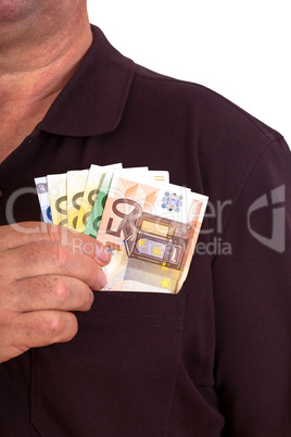 Man pushes money into his breast pocket