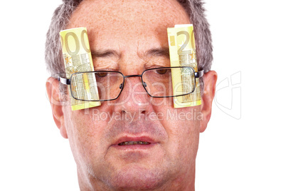 Man with banknotes behind the glasses