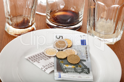 Empty glasses and plates with tip