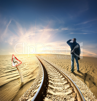 Man and railway in desert