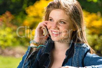 Pretty young girl talking on the phone