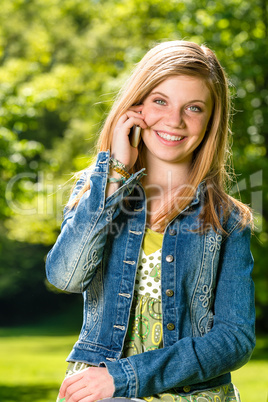 Lively young girl talking on her phone