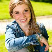 Joyful young girl enjoying sunshine outdoors